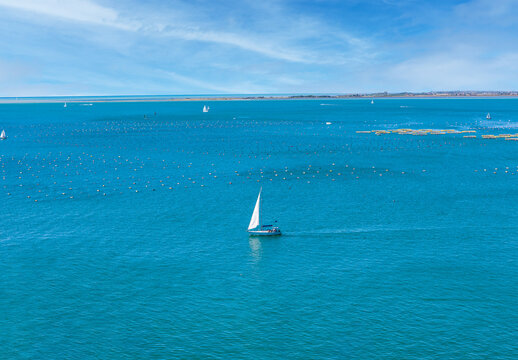 The yacht is on the emerald Adriatic Sea near Duino, Gulf of Trieste, Italy.Breeze