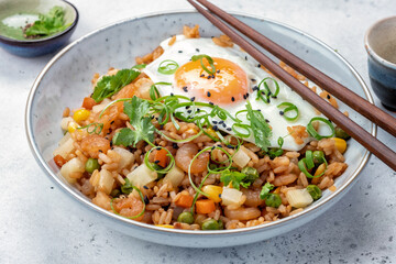 Shrimp fried rice with vegetables and fried egg
