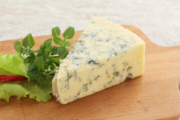 Blue cheese piece over board