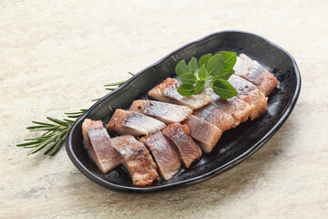 Delicous sliced herring fillet in grape sauce