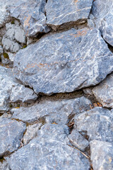 Texture of a stone wall close-up, selective focus. Stone wall as background or texture.