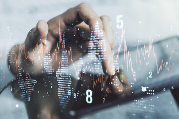 Abstract creative financial graph with finger clicks on a digital tablet on background, financial and trading concept. Multiexposure