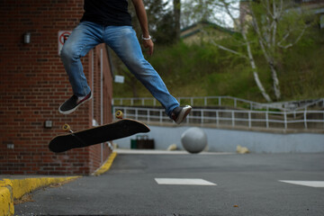skateboarder in action, with kickflip