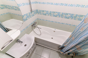 Russia, Moscow- May 21, 2020: interior apartment room bathroom, sink, decorative elements, toilet