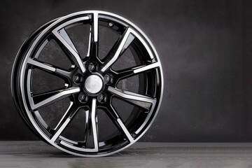 alloy wheels auto parts on a black background copy space