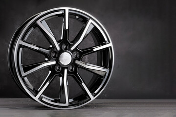 Obraz premium alloy wheels auto parts on a black background copy space