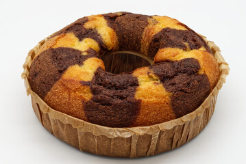 Bicolor cake on a baking sheet isolated on white background.