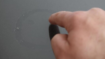 Smiley painted on the glass with dust.