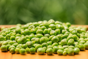 Close up view of fresh raw peas. Healthy organic green raw peas.