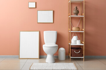 Interior of clean modern restroom with toilet bowl and rack