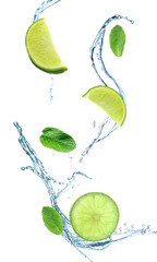 Cut lime, mint leaves and splash of water isolated on white © Pixel-Shot
