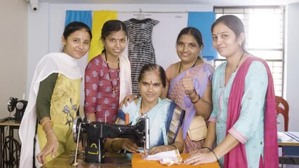 Woman with trainers around showing thumbs up by looking at camera while learning tailoring at class - concept of woman empowerment, growth and development.