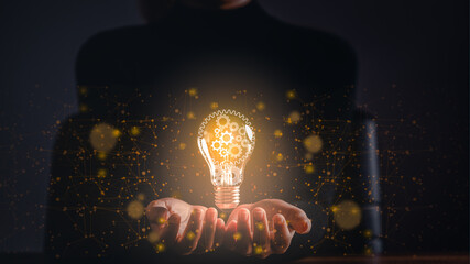 Business woman holding light bulb and gear inside, Idea and Innovation technology, Creative, Inspiration, development, Imagination.