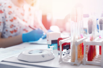Microbiology concept, hand of medical worker on agar plate culture bacteria, resistance of pathogens and bacterial identification in lab