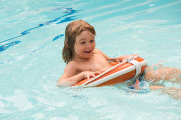 Kids summer vacation. Activities at pool. Summertime party. Pool resort. boy with swimming ring.