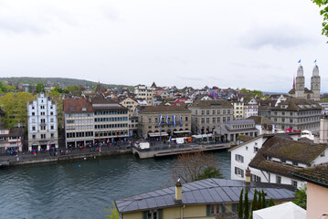 Children's parade of famous spring festival at Limmat Quay with guest Canton Uri at City of Zürich on a rainy spring day. Photo taken April 24th, 2022, Zurich, Switzerland.