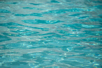 Tansparent clear calm water surface texture. Abstract nature background. Sea water pattern.