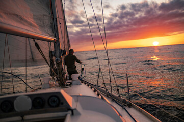 Fototapeta na wymiar Yacht in the sea during Sunset in the Baltic Sea