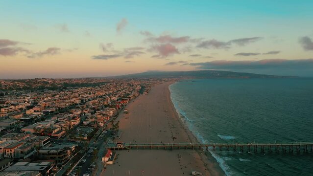 Manhattan Beach Coastal Town In Manhattan Beach Pier During Sunset, California USA. Aerial Wide Shot