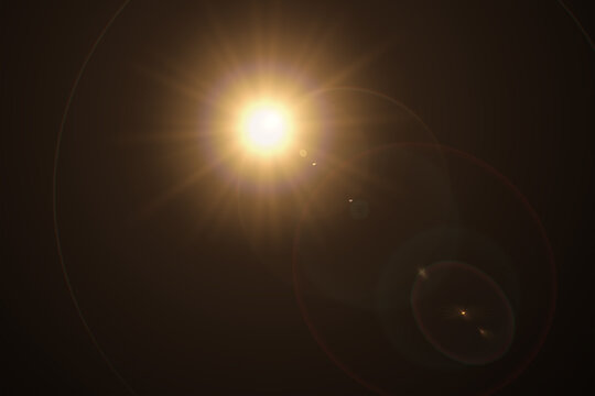 Abstract natural sun flare on the black - Powered by Adobe