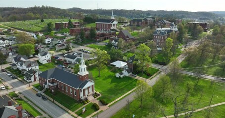 University college campus in small town. Waynesburg University aerial in spring.