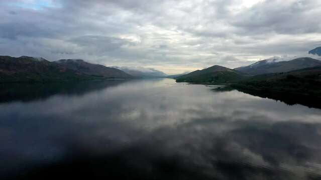 Loch Linnhe, Fort William on a calm Spring morning calm sees reflections and clouds at sunrise