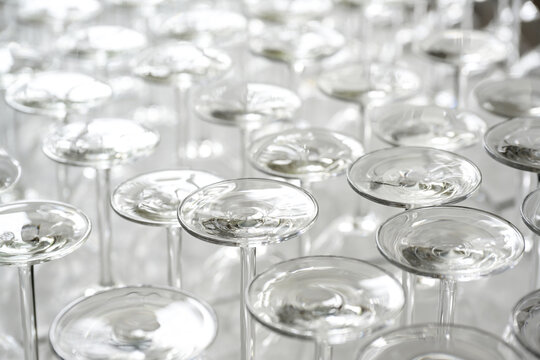 Many wine glasses set upside down for a food and drink event, full frame background, copy space, selected focus