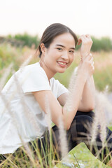 Fototapeta na wymiar Happy smiling east asian woman in outdoor summer