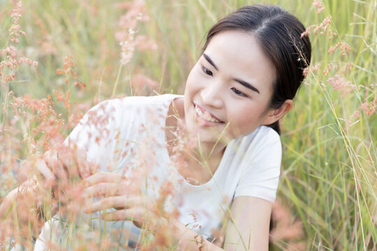 Happy smiling east asian woman in outdoor summer