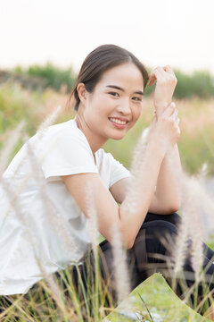 Happy smiling east asian woman in outdoor summer