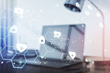 Double exposure of creative abstract medical hologram on laptop background. Healthcare technolody concept