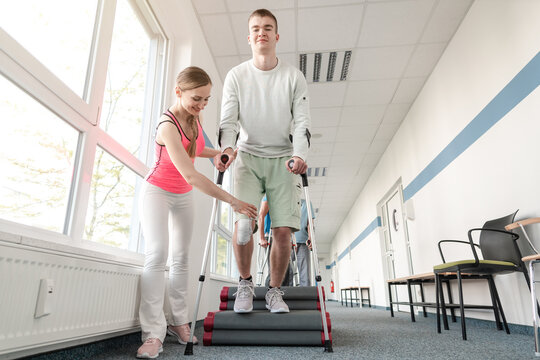 People in rehabilitation learning how to walk with crutches after having had an injury