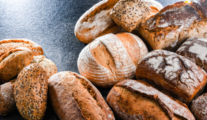 Assorted bakery products including loafs of bread and rolls