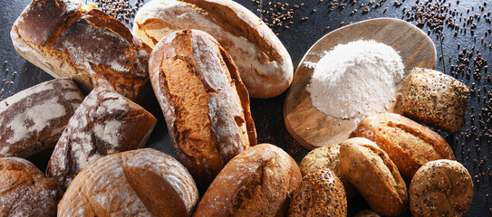 Assorted bakery products including loafs of bread and rolls