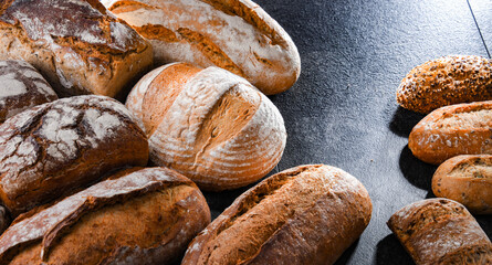 Assorted bakery products including loafs of bread and rolls
