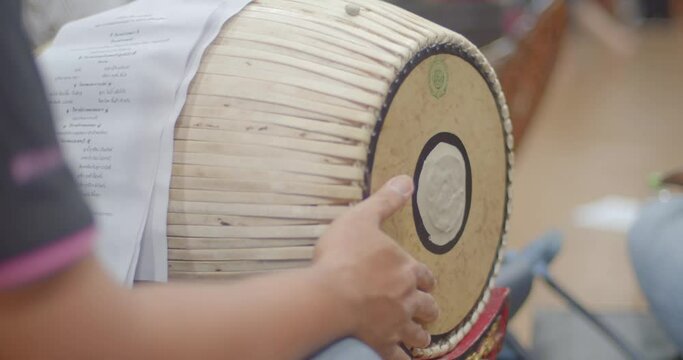 Thai musical instruments.The two-faced drum is used for mixing rhythms in a Piphat orchestra. acting as a rhythm regulator