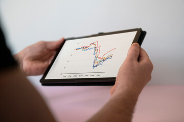 Hand holding digital tablet