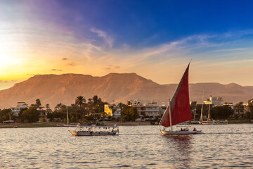 Sailboat on Nile at sunset - obrazy, fototapety, plakaty