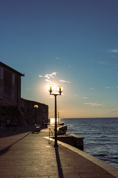 Romantic sunset thru street lantern.
