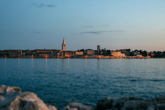 Porec city sideview with sunset.