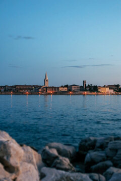 Porec city sideview with sunset.