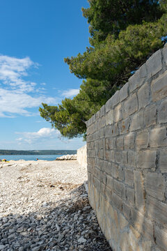 Mediterranean blue coast line, beach with rocks and stone.