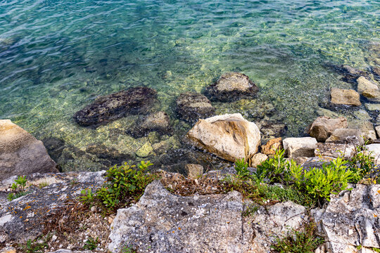 Mediterranean blue coast line, beach with rocks and stone.