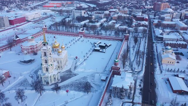 Scenic view from drone of snow covered Tula Kremlin and Holy Assumption Cathedral on background with cityscape, Russia