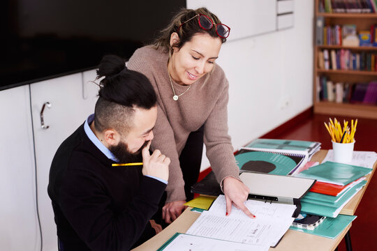 Teachers talking in classroom