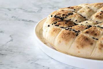 close-up of seeded bread, space to write on the left