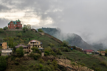 Fototapeta premium panoramic view of the mountains ancient settlements and gorges on a spring sunny day