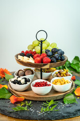 Healthy organic breakfast fruit selection with grapes, strawberry and date sweets