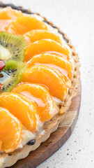 Fruit cake portion with orange and kiwi