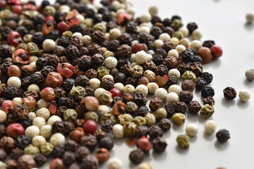 Mixed peppercorns on a plate. 